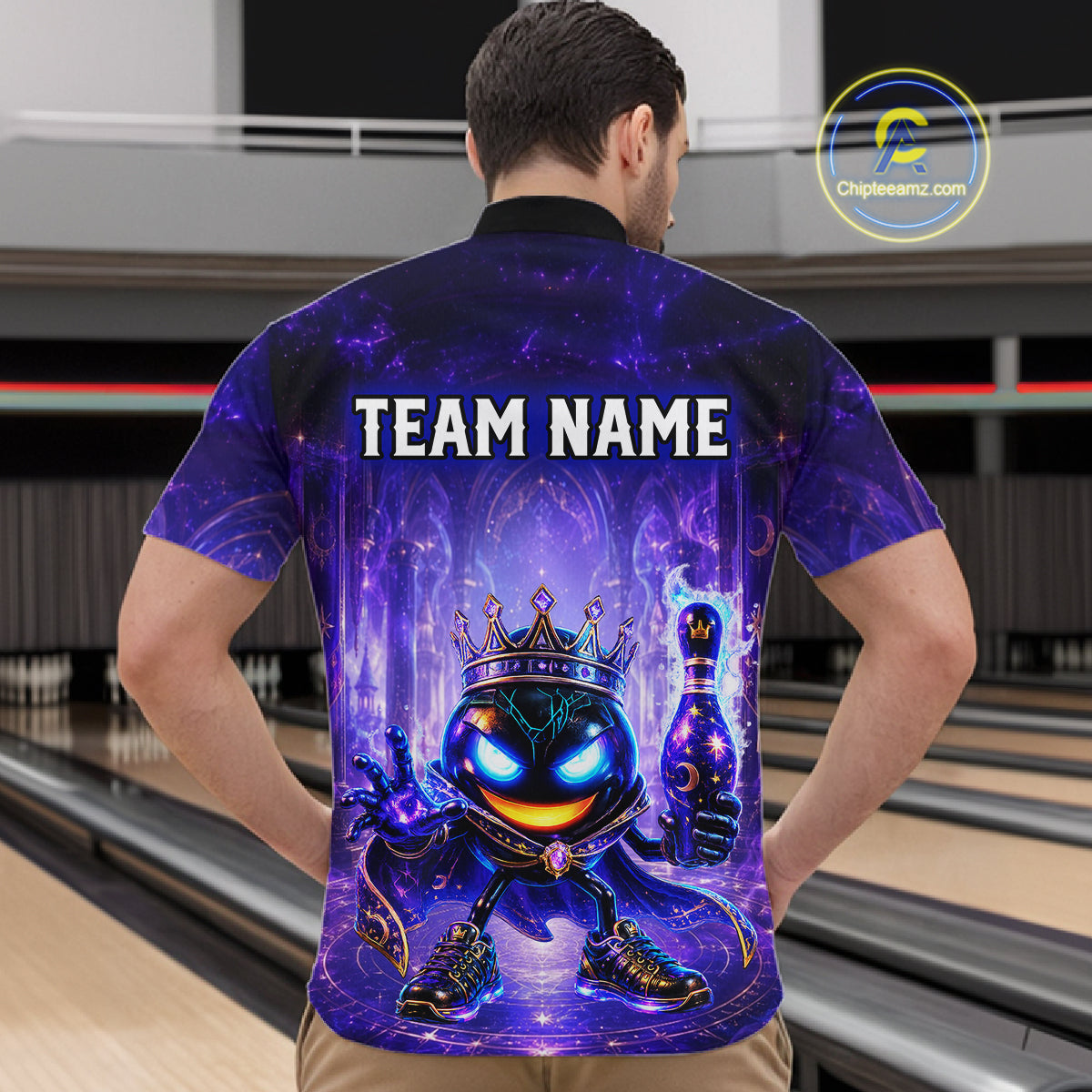 Person wearing a bowling shirt with a colorful design and 'TEAM NAME' text in a bowling alley.