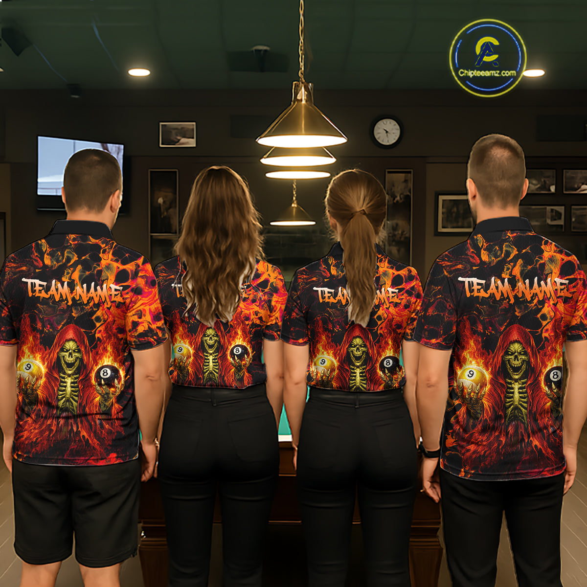 Four people wearing matching shirts with a fiery design in an indoor setting.