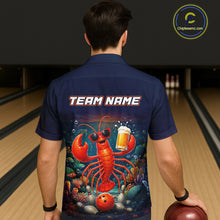 Load image into Gallery viewer, Person wearing a navy blue shirt with a colorful lobster graphic and 'TEAM NAME' text at a bowling alley.