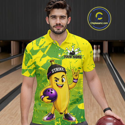 A man wearing custom yellow banana bowling polo shirt front view featuring a funny cartoon fruit and bowling ball, displaying Your Name, at the bowling alley
