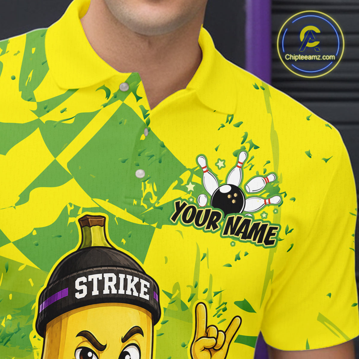 Close-up front view of custom yellow banana bowling polo shirt showing Your Name, funny cartoon banana graphic and green camouflage pattern