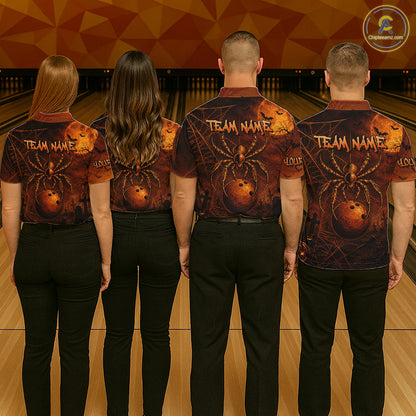 Four people standing from the back in a bowling alley, wearing matching short-sleeve collared shirts with a Halloween-themed spider and bowling ball graphic, paired with black pants. The shirts feature a dark red and black background with a large orange spider and bowling ball design, plus 'TEAM NAME' text on the back.