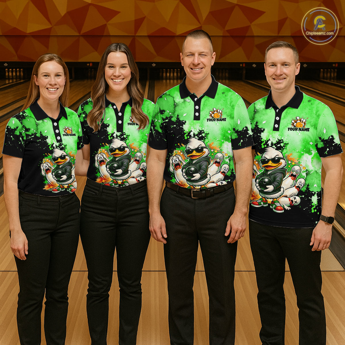 Four people standing together in a bowling alley wearing matching bright green and black polo shirts with a large cartoon duck graphic on the front, paired with black pants. 