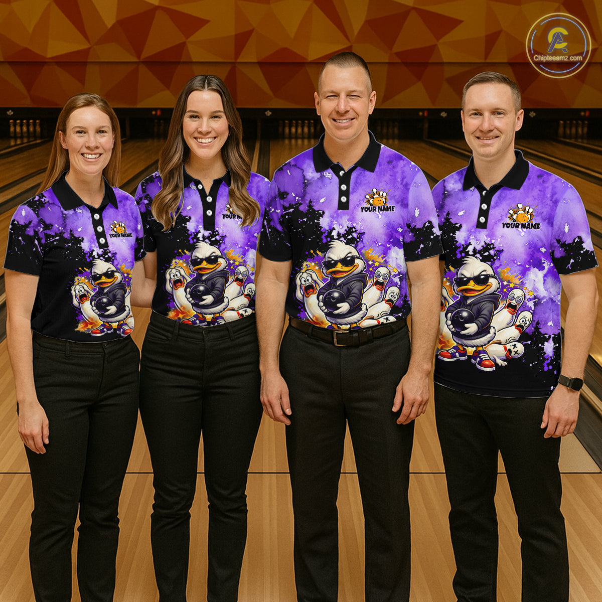 Four people standing together in a bowling alley wearing matching purple and black polo shirts with a cartoon duck graphic 