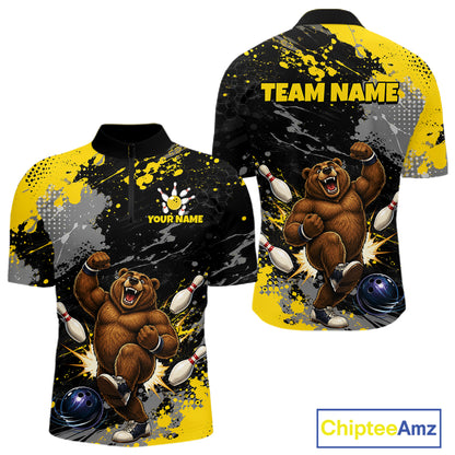 Custom short-sleeve polo shirt shown from front and back, featuring a bold bowling-themed graphic with a roaring brown bear, bowling pins, blue balls, black and yellow paint splatter, and placeholder text reading 'YOUR NAME' and 'TEAM NAME'.