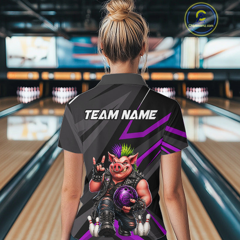 A woman viewed from behind wearing a custom bowling shirt with a pig graphic and 'TEAM NAME' text, standing in a bowling alley.