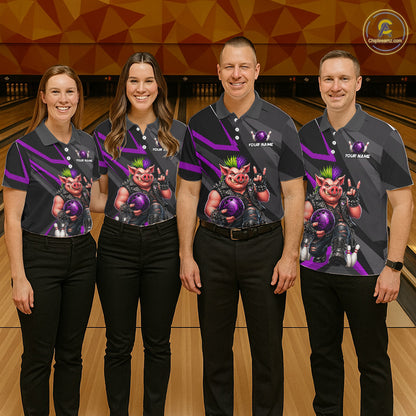 Four people standing in a bowling alley wearing matching dark gray custom-printed polo shirts with purple graphics and cartoon character artwork. The shirts have white placeholder text reading 'YOUR NAME'.