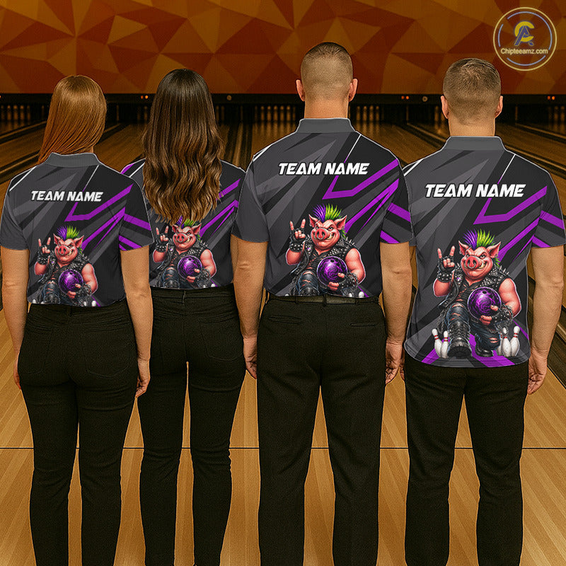 Four people standing with their backs to the camera in a bowling alley, wearing matching dark gray bowling shirts with purple graphic stripes and a cartoon pig character on the back. The shirts have 'TEAM NAME' printed in white on the upper back.