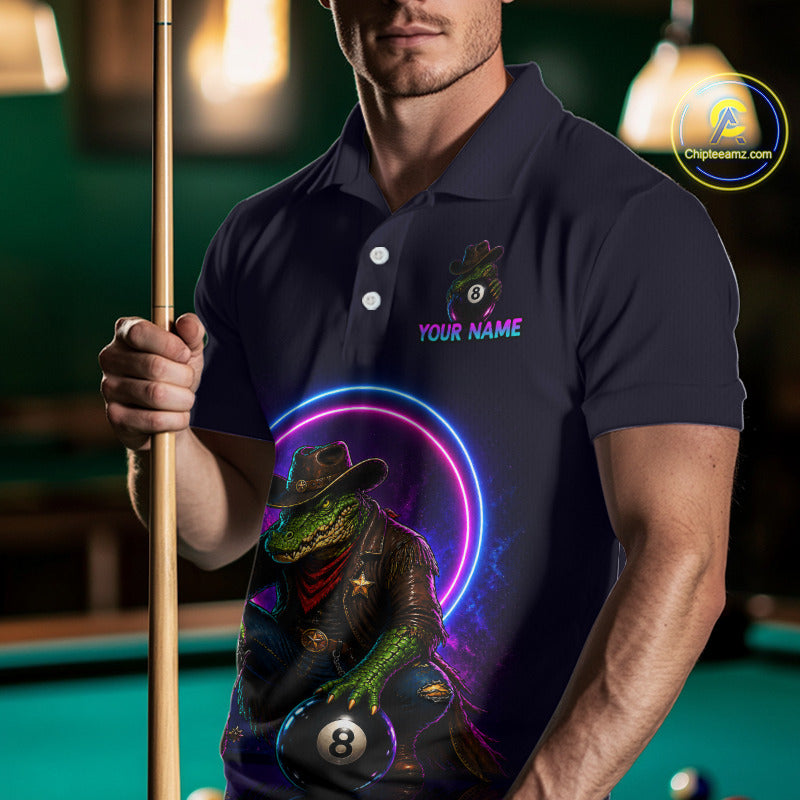 Man holding a pool cue wearing a navy blue polo shirt with a colorful graphic design.