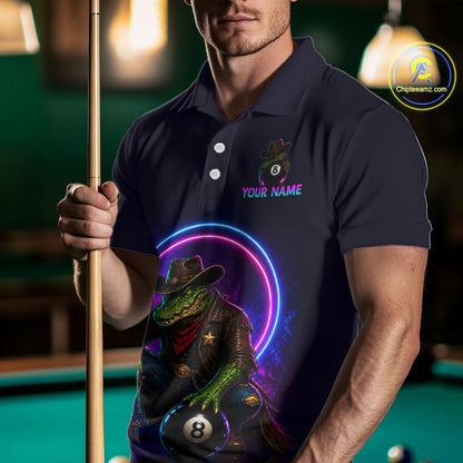 Man holding a pool cue wearing a navy blue polo shirt with a colorful graphic design.