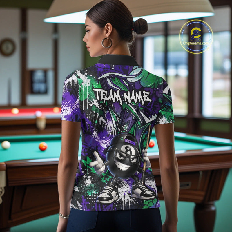 Person wearing a colorful polo shirt with a pool ball design in a billiards room.