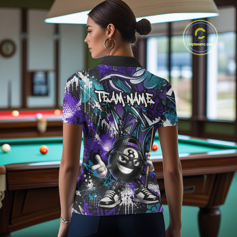 Person wearing a colorful polo shirt with a pool ball design in a billiards room.