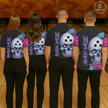 Load image into Gallery viewer, Four people wearing shirts with colorful skull designs on a bowling alley floor.