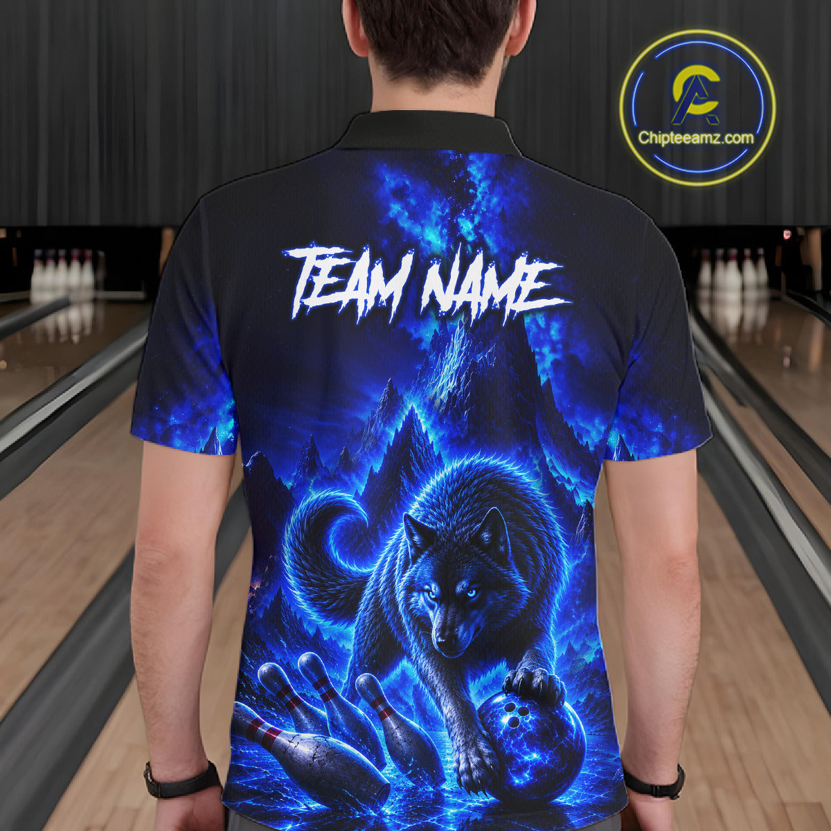 Person wearing a black bowling shirt with blue wolf design and 'TEAM NAME' text in a bowling alley.