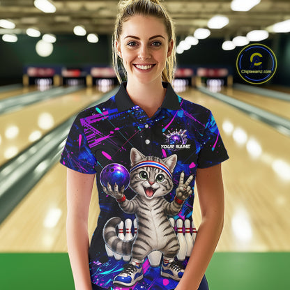 Woman wearing a colorful bowling shirt with a cat design in a bowling alley.