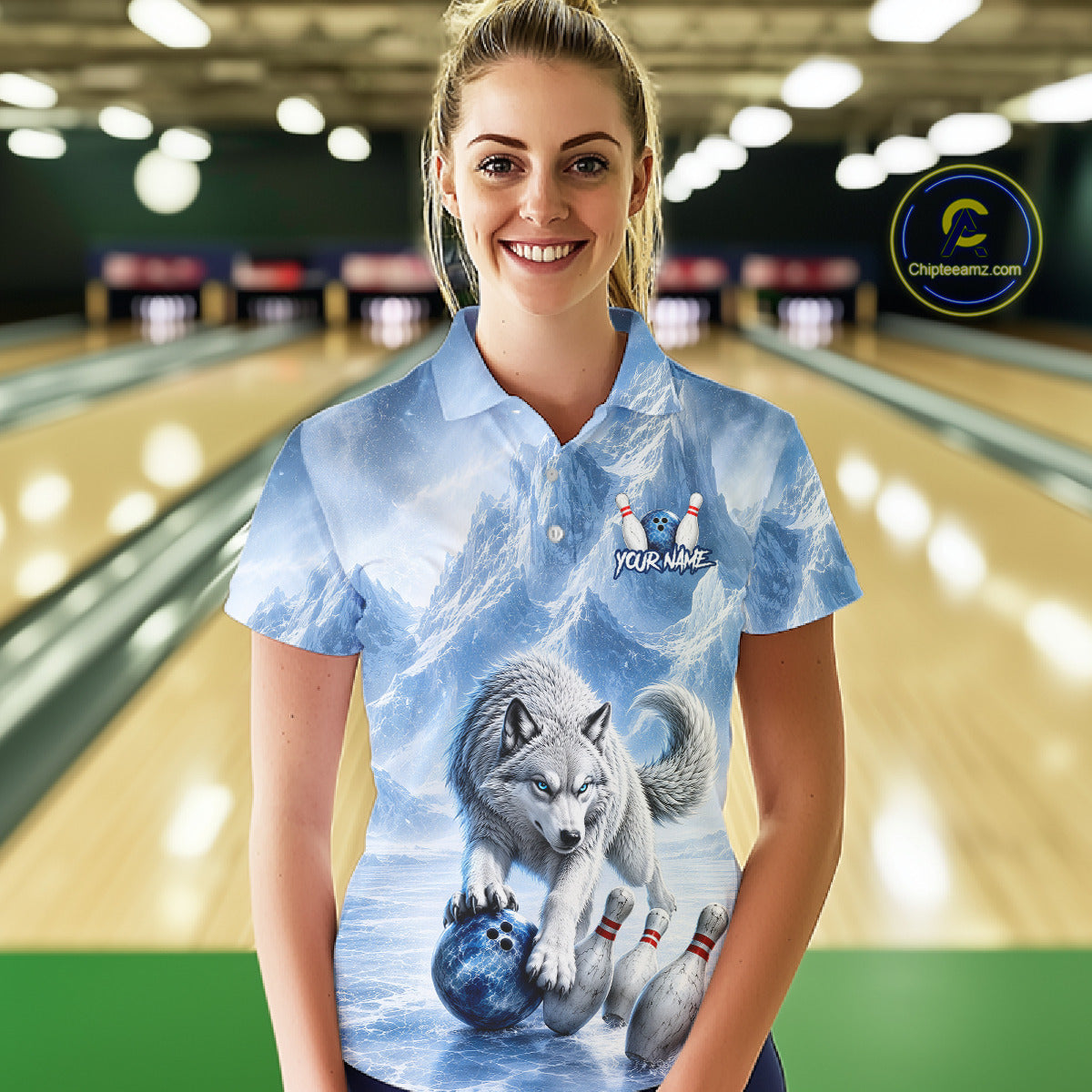 Woman wearing a bowling shirt with a wolf design in a bowling alley.