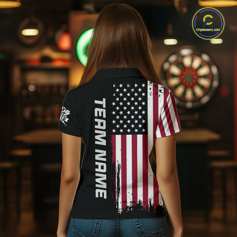 Back view of a woman wearing a custom patriotic dart polo with personalized team name and a distressed American flag graphic in a professional dart room.