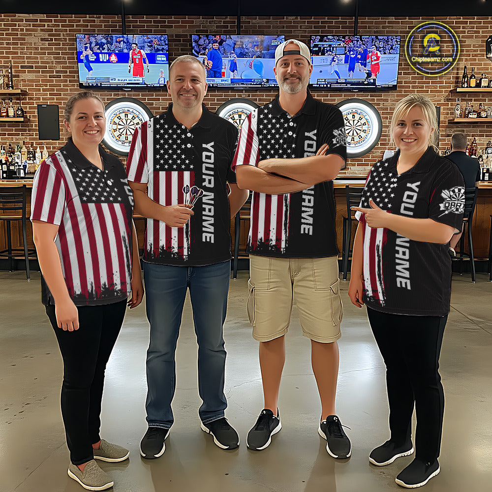 Group of four wearing matching custom brown dart polo shirts featuring distressed American flag graphics in a professional dart room.