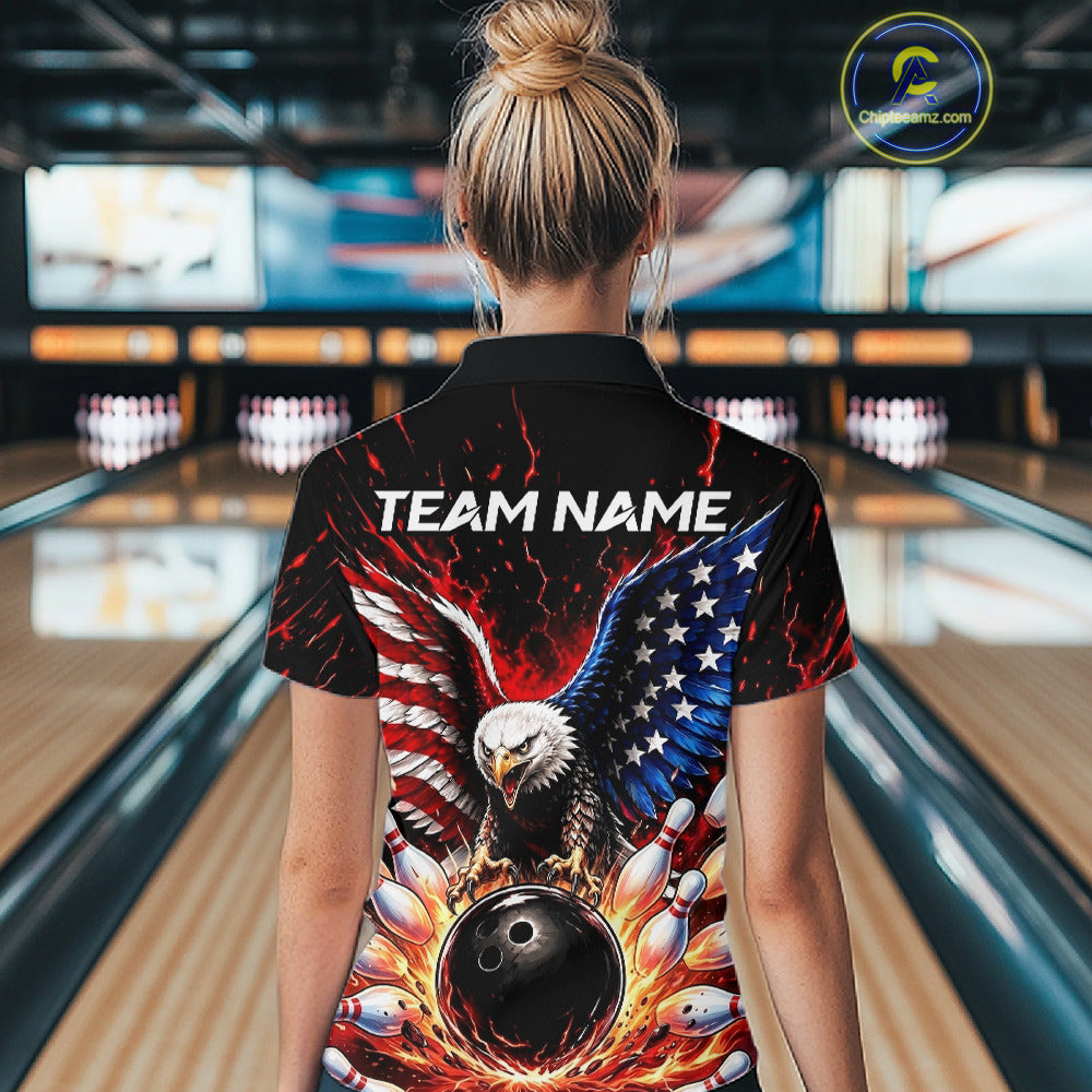 Person wearing a bowling shirt with an eagle and American flag design in a bowling alley.