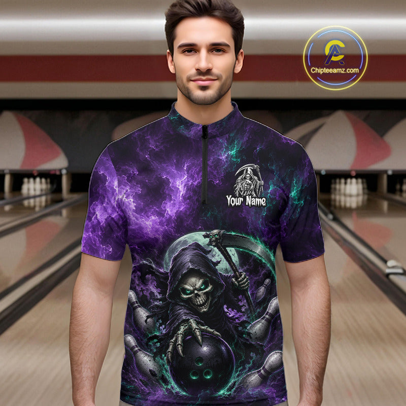 A man wearing a short-sleeve zip-front shirt with a dark purple and black graphic print featuring a grim reaper holding a bowling ball, set against a bowling alley background. 