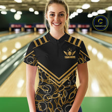 Load image into Gallery viewer, Female model wearing a custom black gold bowling quarter-zip shirt front view featuring a golden winged bowling ball emblem, geometric line pattern and premium black gold design at the bowling alley
