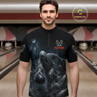A man wearing a black short-sleeve zip-front bowling shirt with a large dark gothic grim reaper graphic on the front, red 'YOUR NAME' text, and small winged skull motifs on the sleeves. Bowling alley lanes are visible in the background