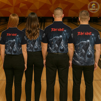 Four people standing in a bowling alley, shown from the back, wearing matching dark short-sleeve shirts with a large gray ghost graphic and red 'TEAM NAME' text across the upper back.