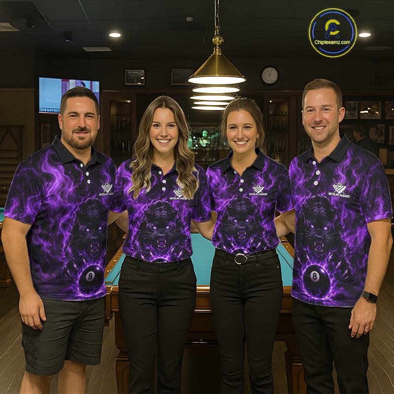 Four people standing in a bar or lounge setting wearing matching dark polo shirts with a vivid purple skull-and-balls graphic print. The shirts feature a black base with glowing purple lightning effects and a large central skull motif with a white ball at the bottom.
