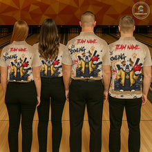 Load image into Gallery viewer, Four people standing in a bowling alley, viewed from behind, wearing matching beige short-sleeve button-up shirts with a large dog-themed bowling graphic and red 'TEAM NAME' text on the back, paired with black pants.