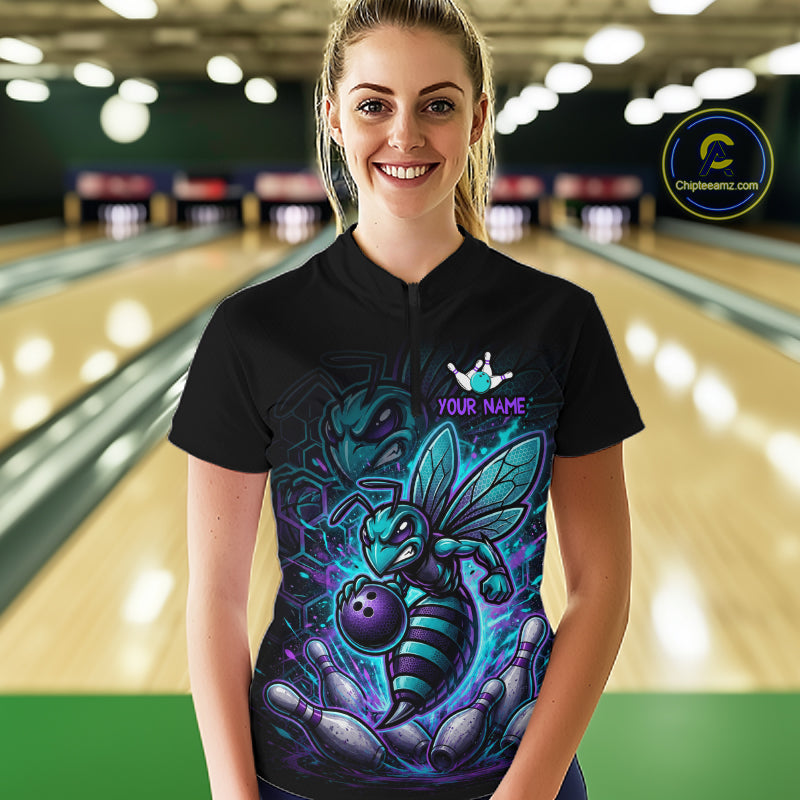 Woman wearing a black bowling polo with teal and purple bee graphics, custom team text, bowling pins, and a purple bowling ball.