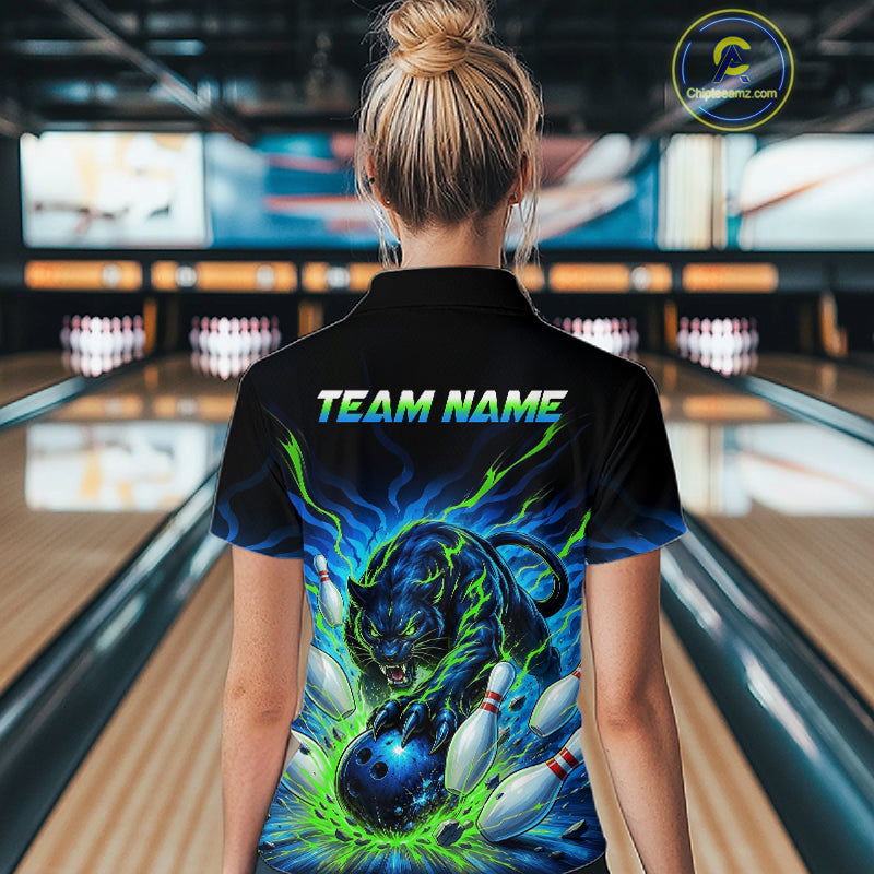 Person wearing a bowling shirt with a panther design and 'TEAM NAME' text in a bowling alley.