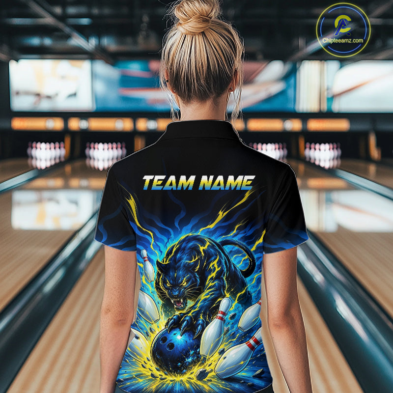 Person wearing a black bowling shirt with a panther design and 'TEAM NAME' text in a bowling alley.