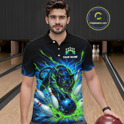 Man wearing a black bowling shirt with a colorful panther design in a bowling alley.