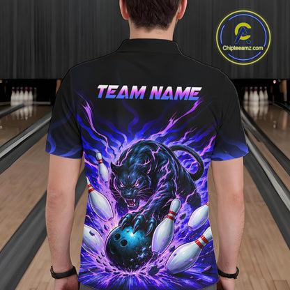 Person wearing a black shirt with a colorful design of a panther and bowling ball in a bowling alley.