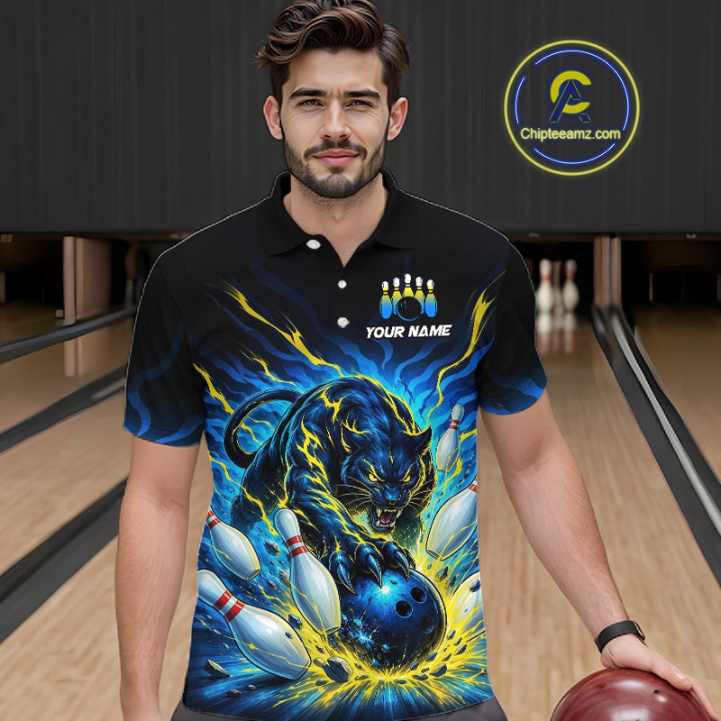 Man wearing a black bowling shirt with a panther design in a bowling alley.