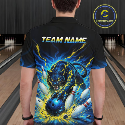 Person wearing a black bowling shirt with a colorful design and 'TEAM NAME' text in a bowling alley.