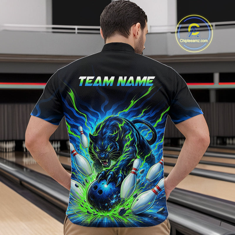 Man wearing a black bowling shirt with a colorful tiger design and 'TEAM NAME' text in a bowling alley.