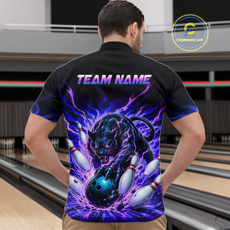 Man wearing a black bowling shirt with a colorful tiger design and 'TEAM NAME' text in a bowling alley.