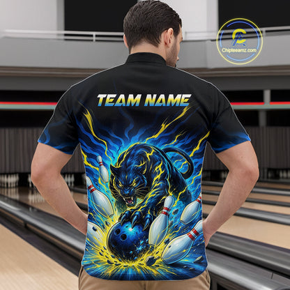 Man wearing a black bowling shirt with a panther design and 'TEAM NAME' text in a bowling alley.