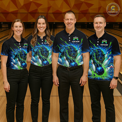 Four people wearing matching bowling shirts with a colorful design on a bowling alley.