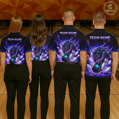 Four people wearing bowling-themed shirts with a team name on a bowling alley.