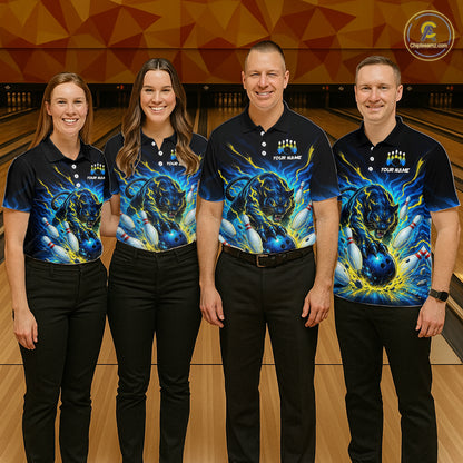 Four people wearing matching bowling shirts with a dragon design on a bowling alley.
