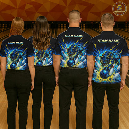 Four people wearing matching bowling shirts with a team name on a bowling alley.