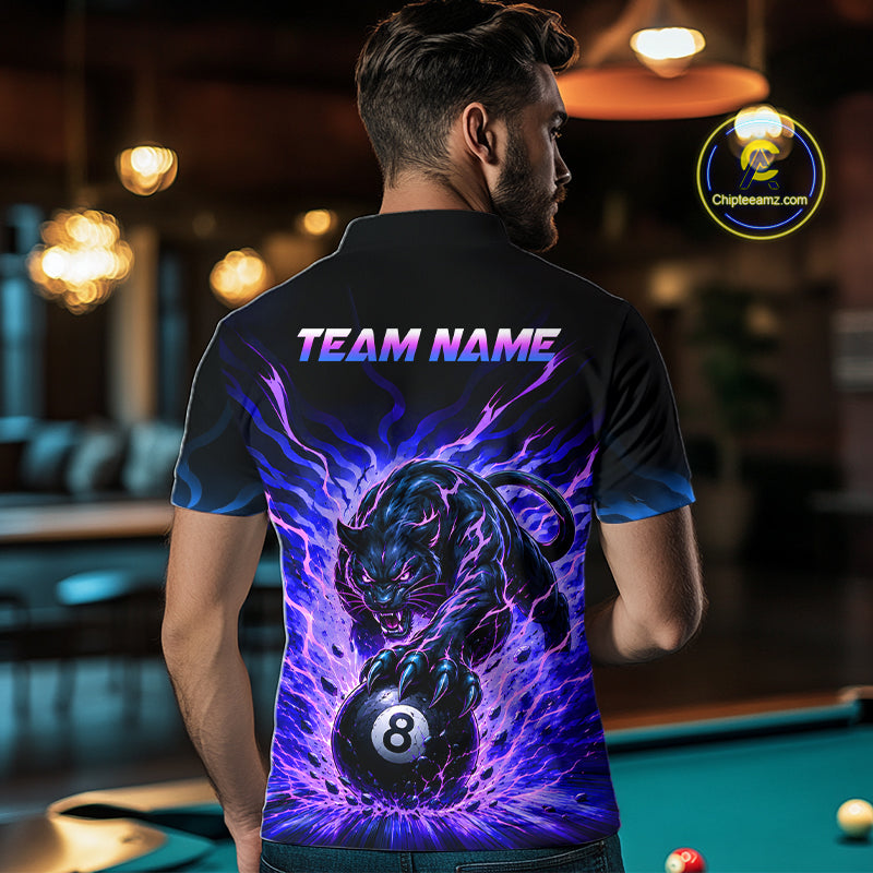 Person wearing a black t-shirt with a colorful panther design and 'TEAM NAME' text, standing in a pool hall.