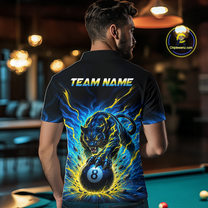 Person wearing a black t-shirt with a colorful design and 'Team Name' text, standing in a pool hall.