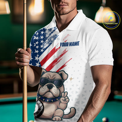 Man wearing a white polo shirt with a dog graphic and American flag design, holding a pool cue on a billiards table.