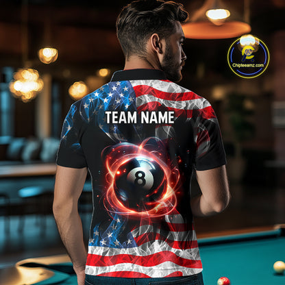 A man viewed from behind wearing a custom short-sleeve polo shirt with an American flag and billiards theme. The back of the shirt features a black background with a stylized 8-ball, red and orange light effects, and a distressed American flag pattern in red, white, and blue.