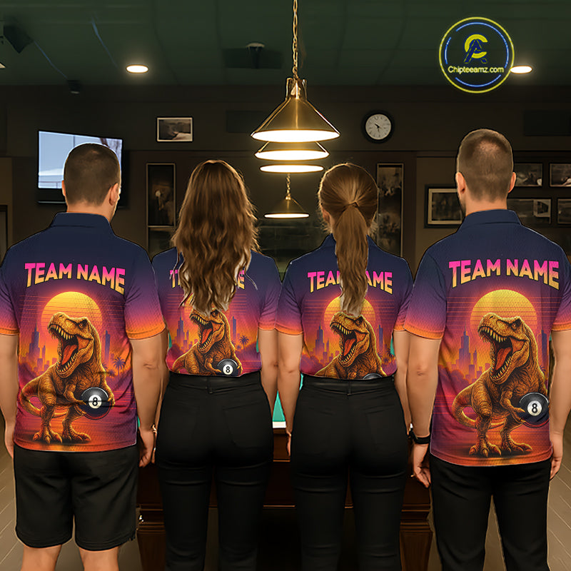 Four people standing with their backs to the camera in a dimly lit indoor room, wearing matching custom polo shirts with a dinosaur graphic and 'TEAM NAME' text. 