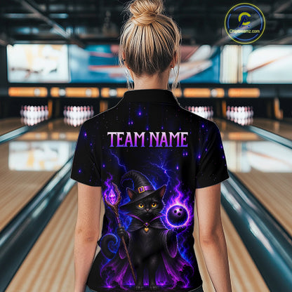 A woman viewed from behind wearing a black short-sleeve polo shirt with a vibrant purple and black wizard cat graphic and the text 'TEAM NAME' on the back, standing in a bowling alley.