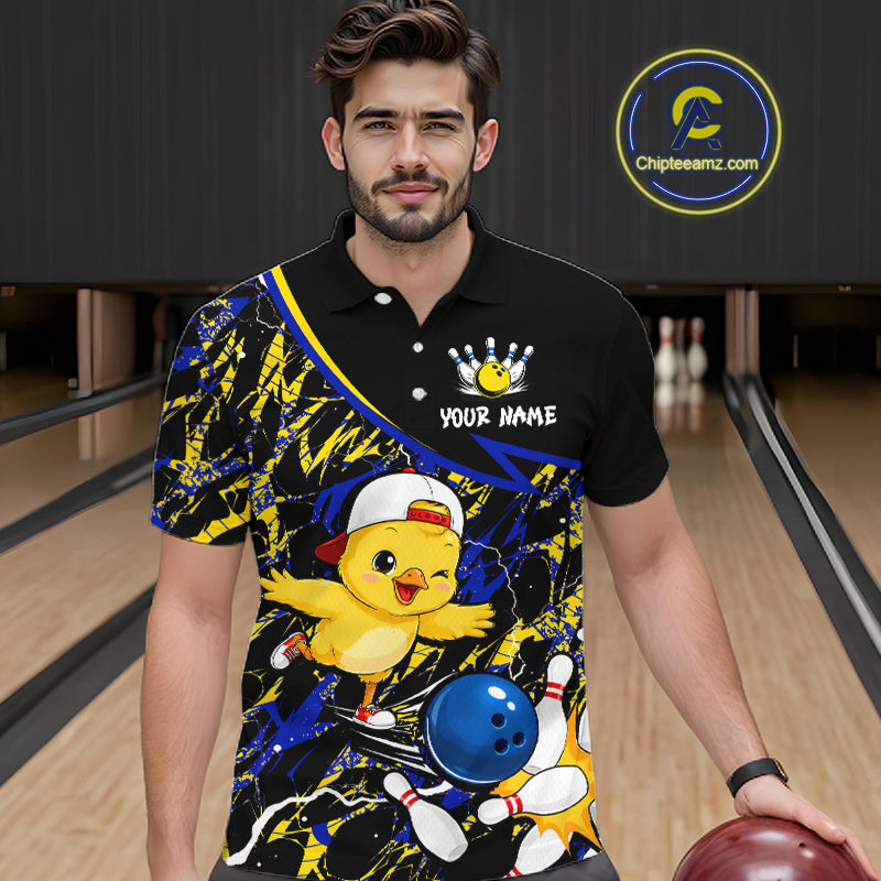 Man wearing a colorful bowling-themed shirt with a chicken design in a bowling alley.